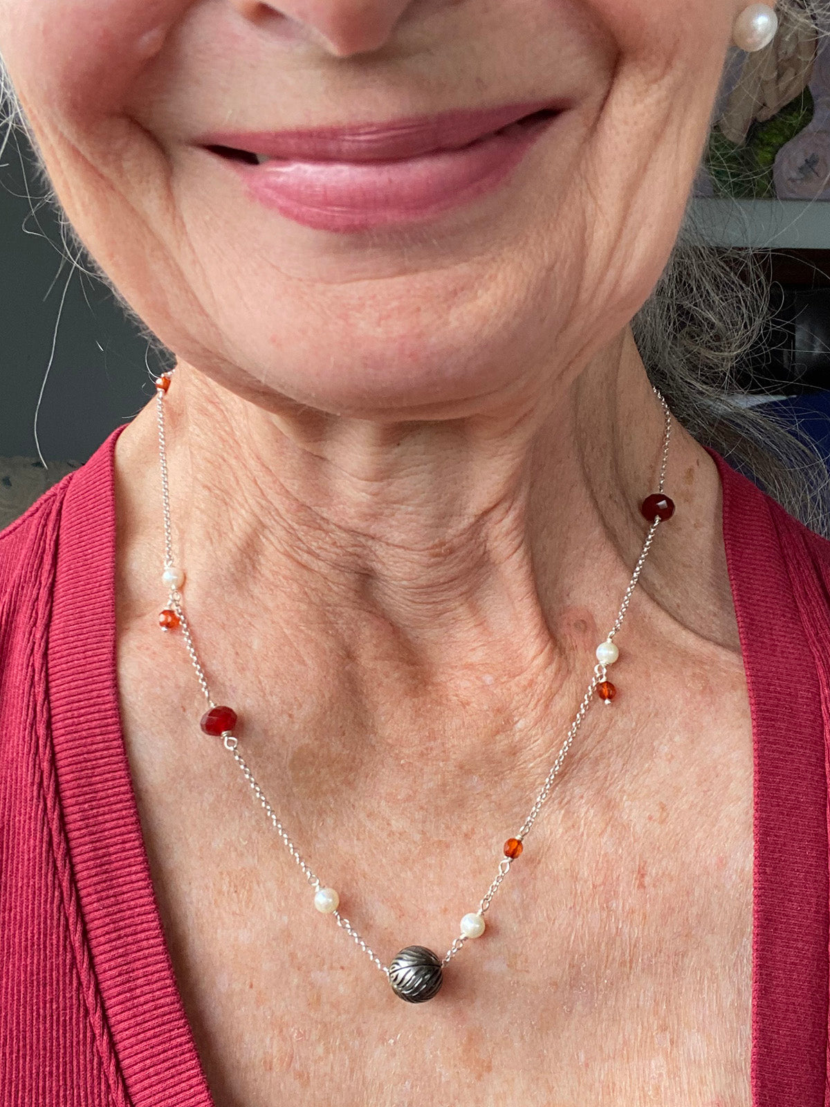 11mm Floating Carved Tahitian Pearl with White Pearls and Garnets by Linda Queally