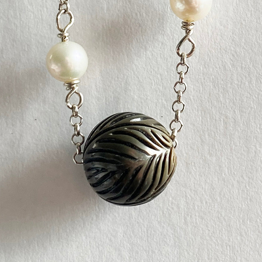 11mm Floating Carved Tahitian Pearl with White Pearls and Garnets by Linda Queally